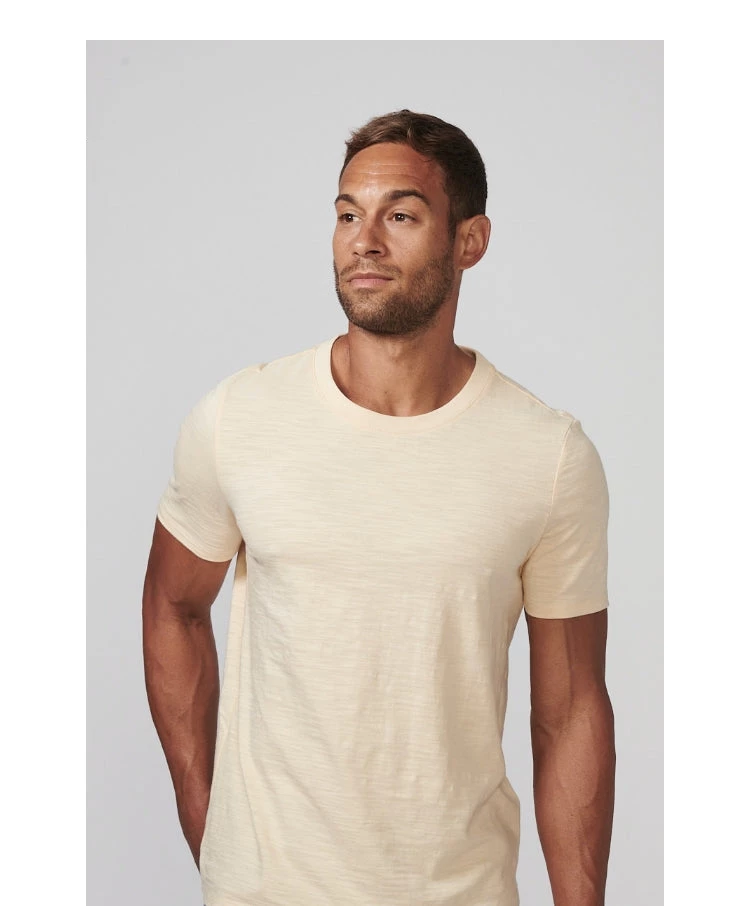 Man looking to the right wearing a short sleeve t-shirt